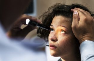 Young Caucasian girl getting an eye examination